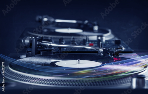 Music player playing vinyl music with colourful abstract lines