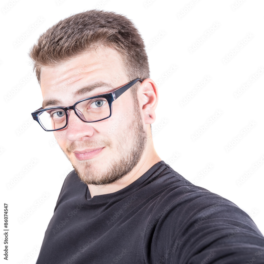 Happy young man taking a selfie photo. Isolated on white background