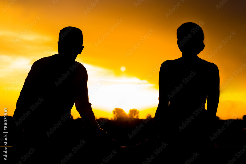 Fototapeta premium Two Silhouettes At Sunset
