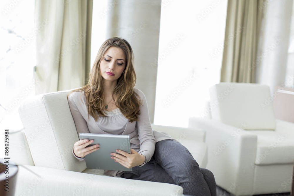 Young woman reading in the room