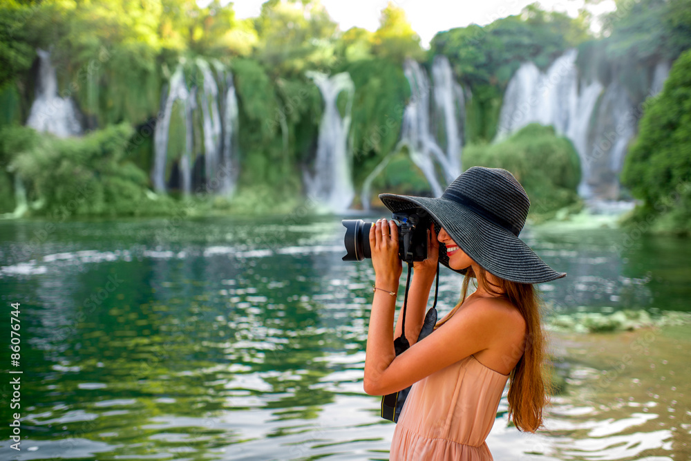 Fototapeta premium Woman tourist near Kravica waterfall