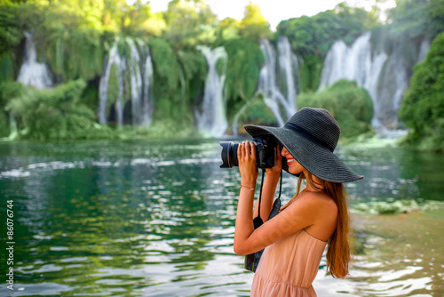 Fototapeta Naklejka Na Ścianę i Meble -  Woman tourist near Kravica waterfall