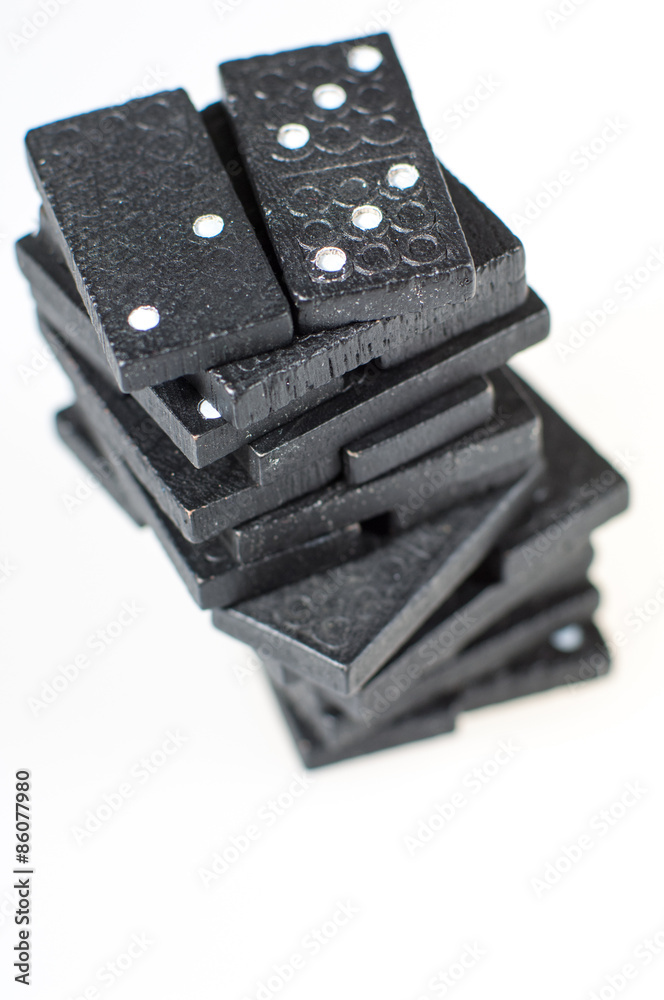 Black dominoes stacked in a tower Black dominoes stacked in a tower