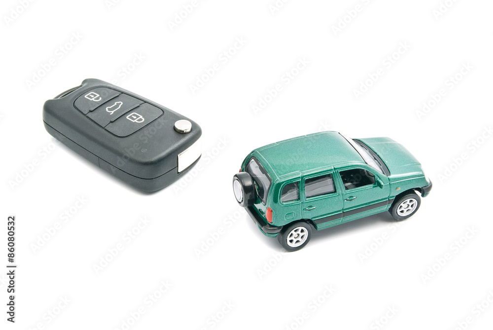 Green car and car keys with alarm on white Green car and car keys with alarm on white