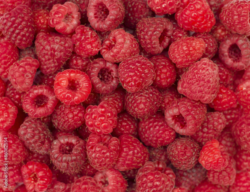 Raspberries fruit background.