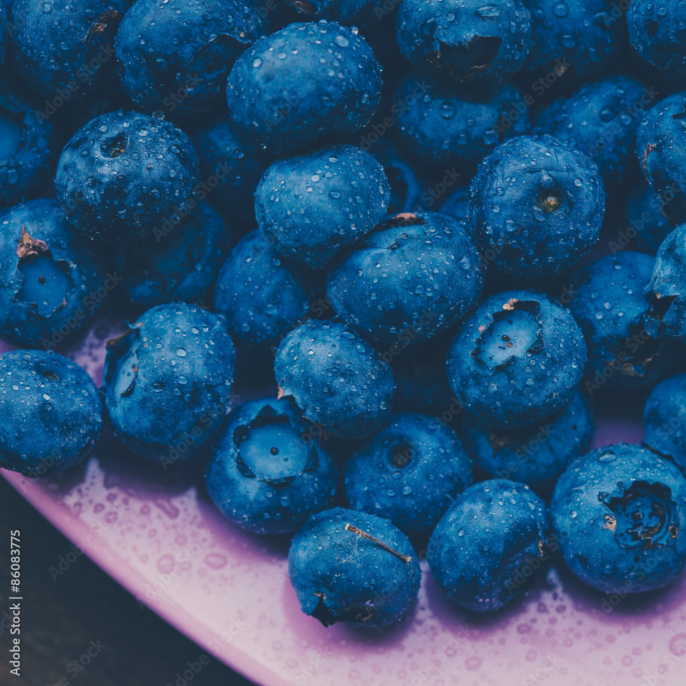 Old bowl of fresh organic blueberries on wooden table.Soft focus Old bowl of fresh organic blueberries on wooden table.Soft focus