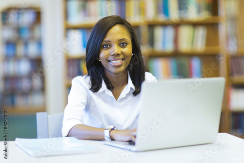 female african university student using laptop