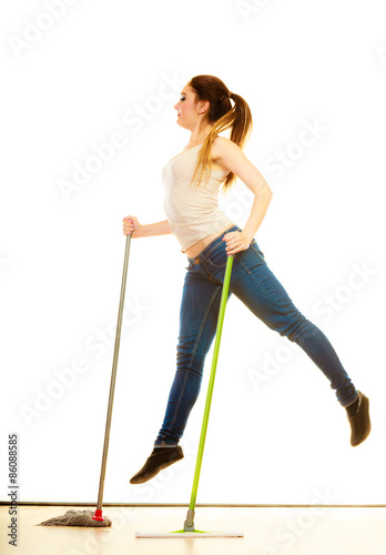 Funny cleaning woman mopping floor jumping