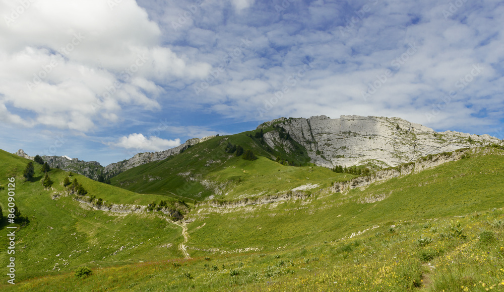 Fototapeta premium mountain with a blue sky and small clouds