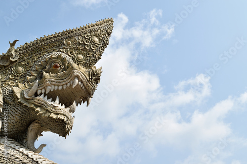 Serpent or naga statue head © pongmoji