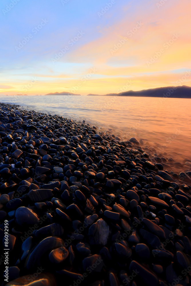 Fototapeta premium .Twilight:An island of smooth polished rocks
