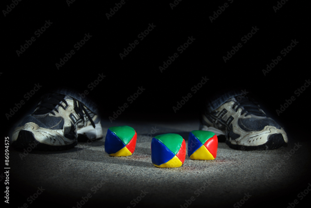 Colorful Footbag with Teenager's Feet at Night