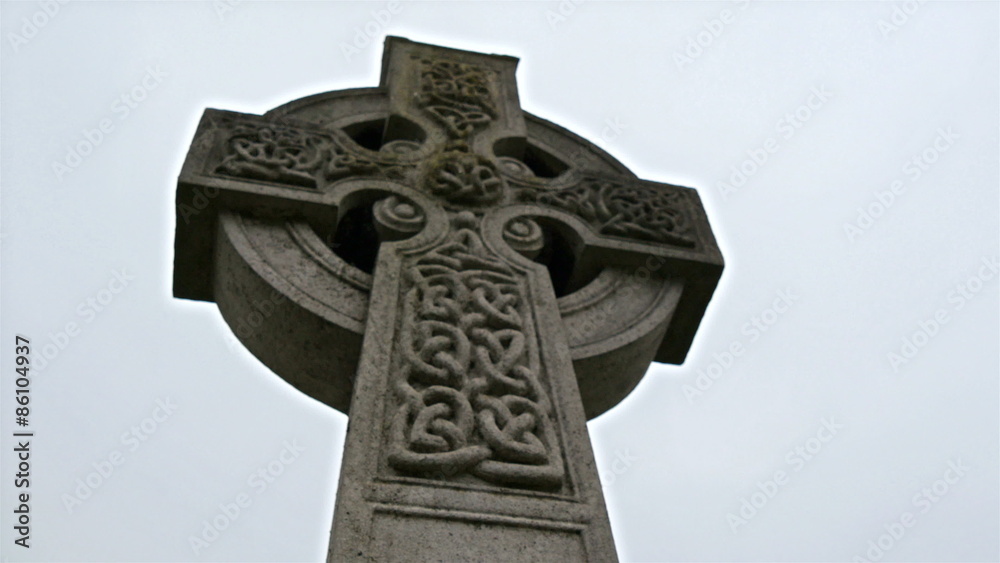 Big cross with carvings tombstones in the cemetery. Lots of this kind of gravestones to be found inside the cemetery Big cross with carvings tombstones in the cemetery. Lots of this kind of gravestones to be found inside the cemetery