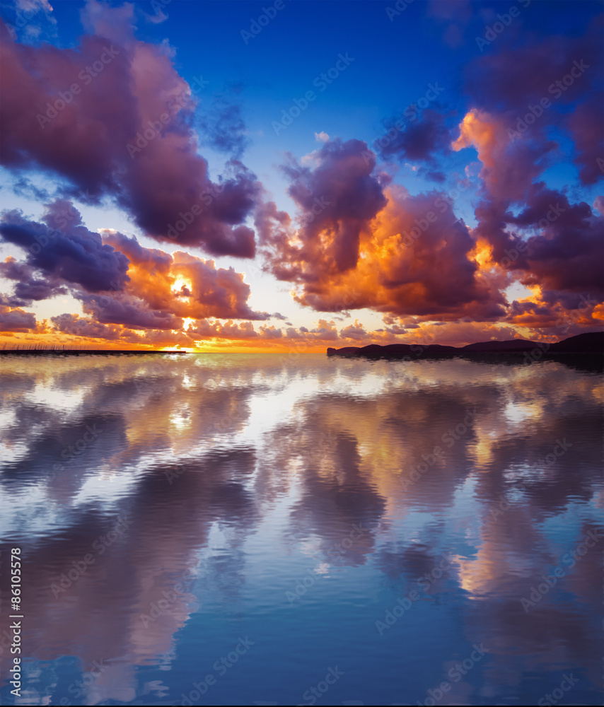 sky reflected in the water at sunset