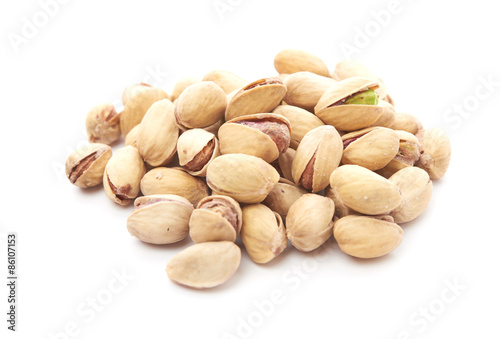 Heap of pistachios nuts isolated on the white