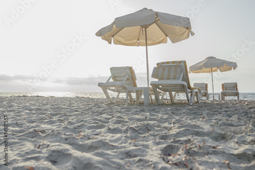 Sandy beach on Greek Kos island with parasols and sunbeds