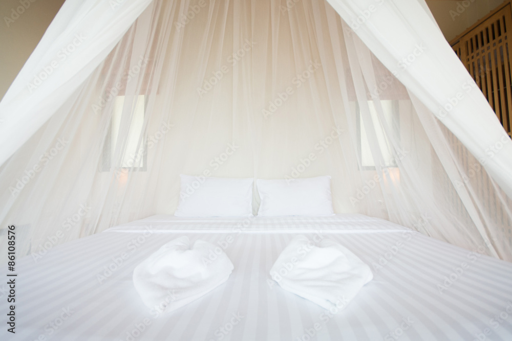 white mosquito net over a bed in a luxurious hotel white mosquito net over a bed in a luxurious hotel