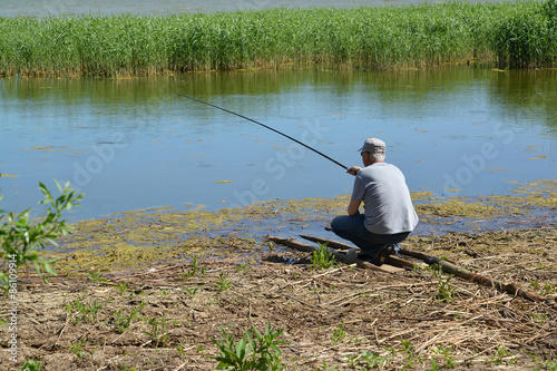 KALININGRAD, RUSSIA - JUNE 06, 2015: The old man catches fish in