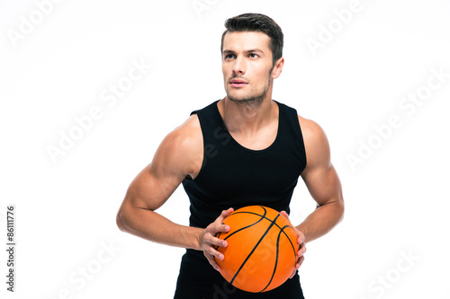 Portrait of a handsome man playing in basketball