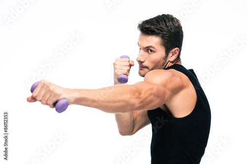 Sports man working out with small dumbbells