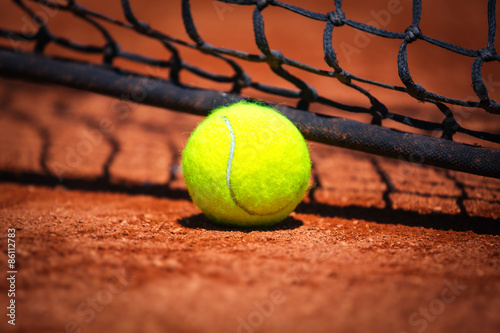 Tennis ball on tennis court © zorandim75