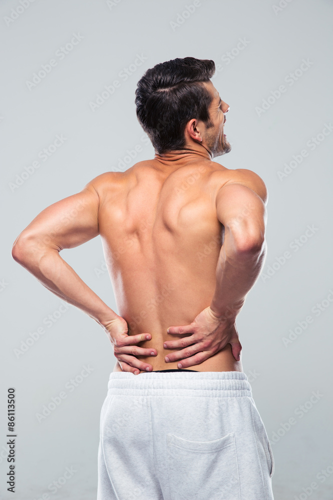 Fototapeta premium Portrait of a man standing with back pain