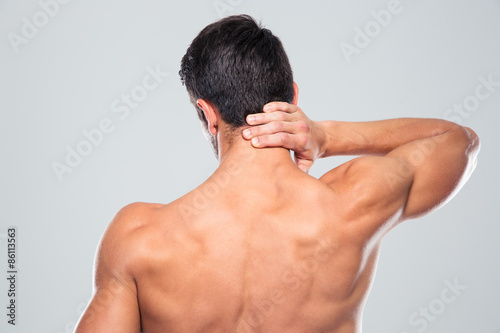 Back view portrait of a man with neck pain