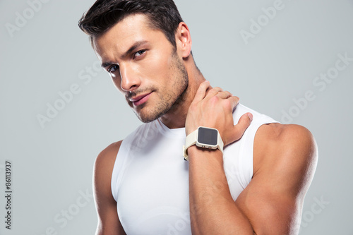 Portrait of a serious fitness man looking at camera