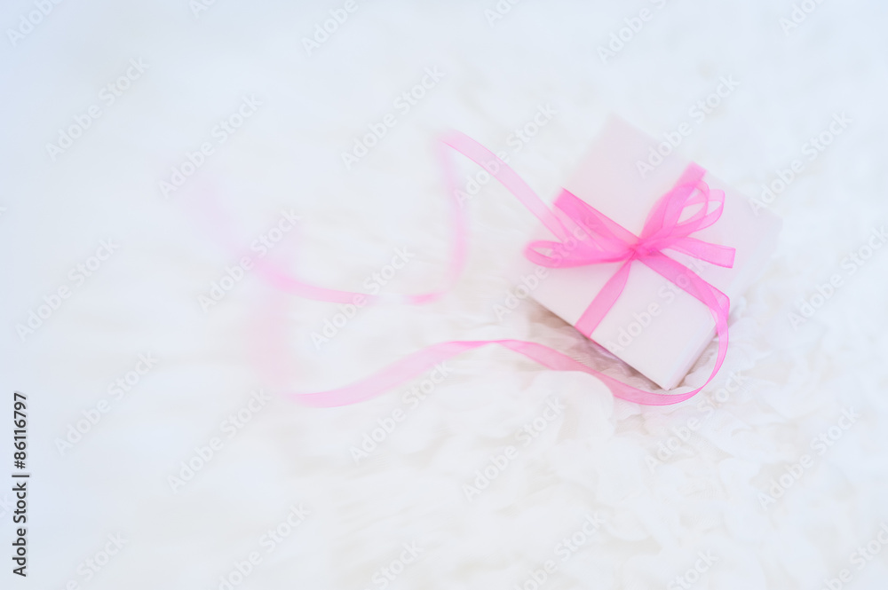 A gift box on a white cloth background A gift box on a white cloth background