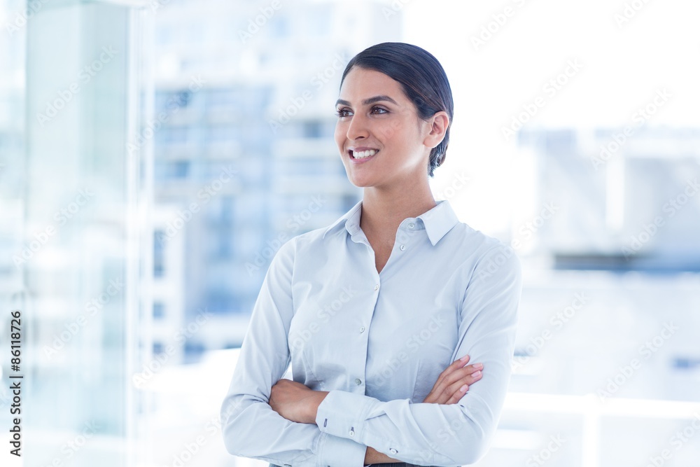 Beautiful businesswoman with arms crossed at office Beautiful businesswoman with arms crossed at office