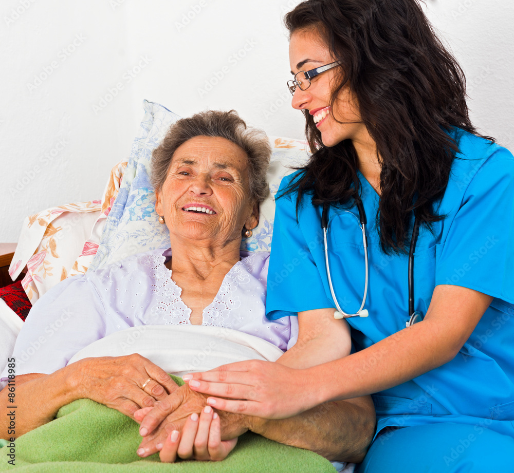 Obraz premium Kind Nurse with Elderly