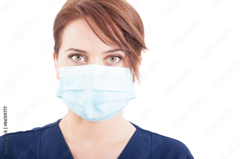 Confident woman doctor face wearing surgical mask Confident woman doctor face wearing surgical mask