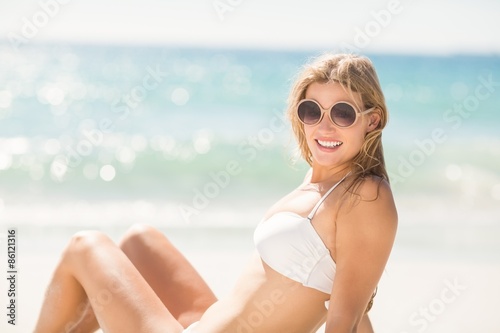 Happy pretty blonde looking at camera with sunglasses 