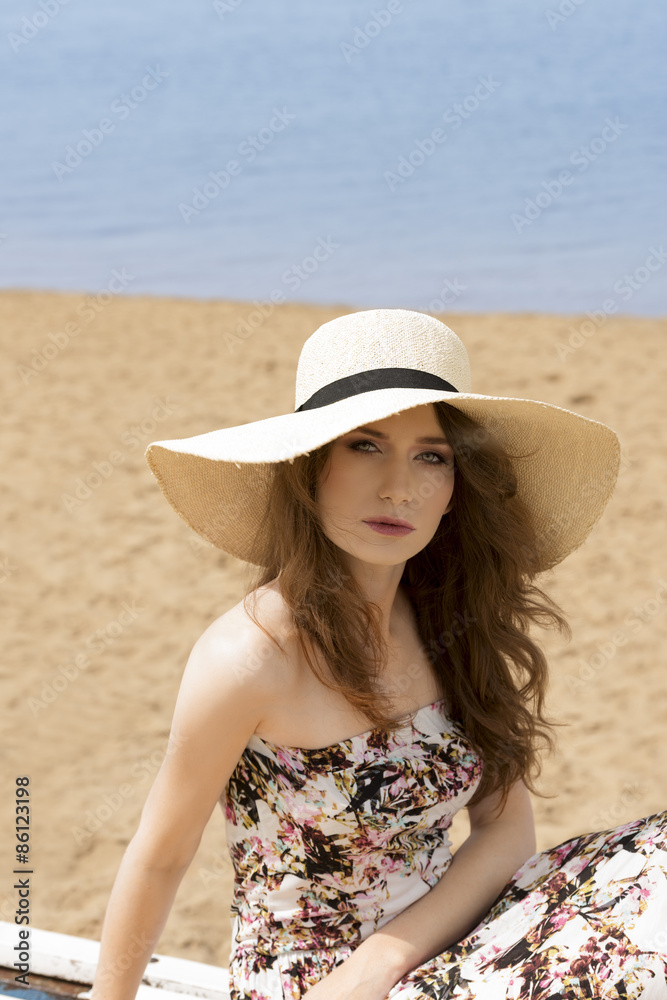 girl in summer dress on the beach