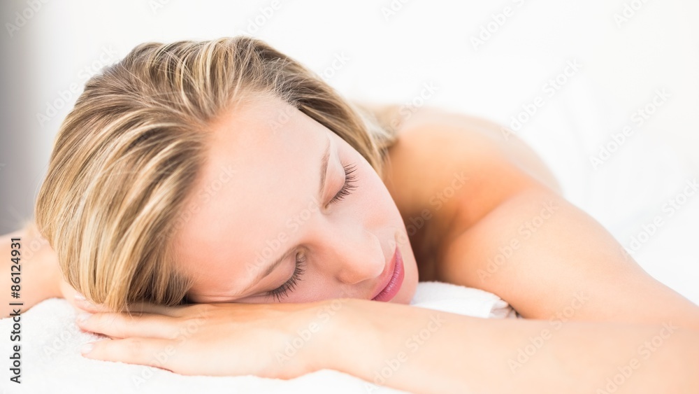 Fototapeta premium Beautiful blonde lying on massage table