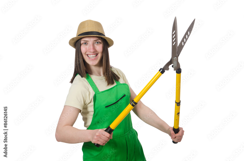 Young woman with shears on white