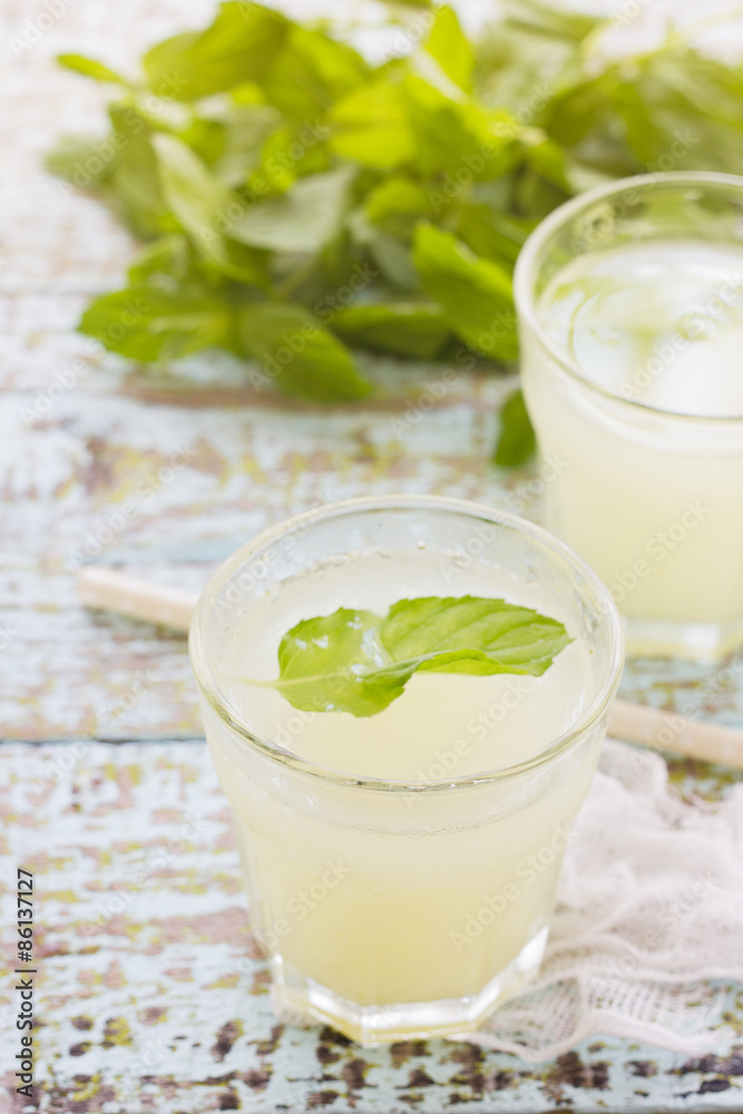 Two glass of fresh lemonade decorated with mint leaves Two glass of fresh lemonade decorated with mint leaves