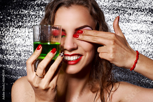 Sensual woman with Creative make-up and glass of alcohol, cockta photo