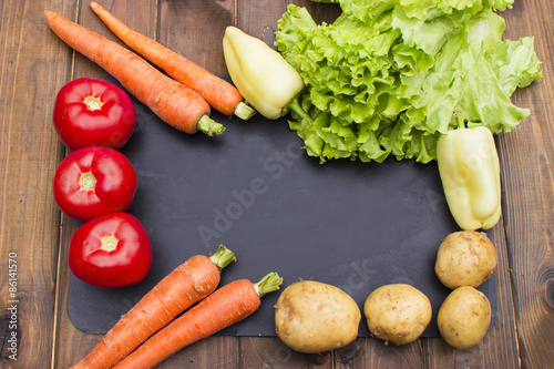 Fresh vegetables on a wooden background