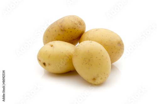 Potatoes on the white background. New harvest.