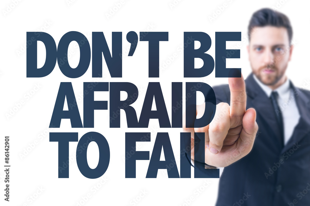 Business man pointing the text: Don't be Afraid to Fail Business man pointing the text: Don't be Afraid to Fail