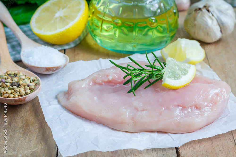 Raw chicken fillet with herbs and spices Raw chicken fillet with herbs and spices