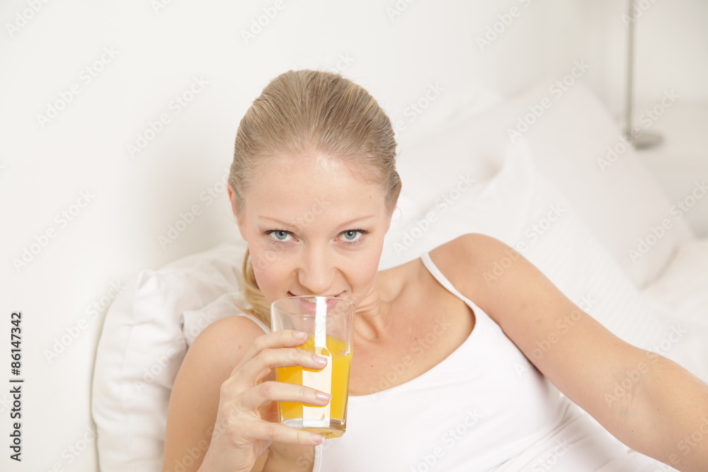 Young woman drinking a juice Young woman drinking a juice