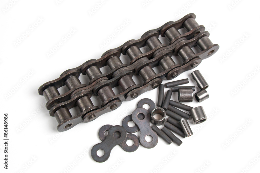 Roller chain and metallic elements isolated on a white background Roller chain and metallic elements isolated on a white background