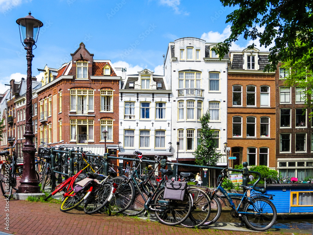 The bicycles and Facades of houses on the channel, Amsterdam, Netherlands