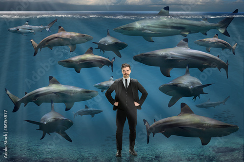 Fotografie, Obraz Businessman Surrounded By Sharks