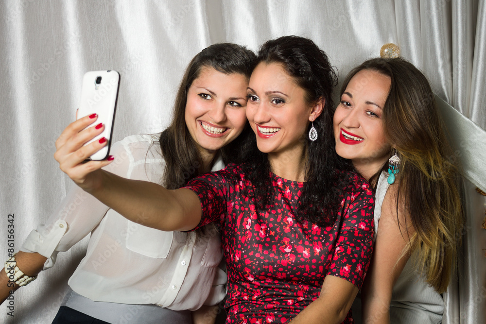 Group of cheerful smiling women make selfie Group of cheerful smiling women make selfie