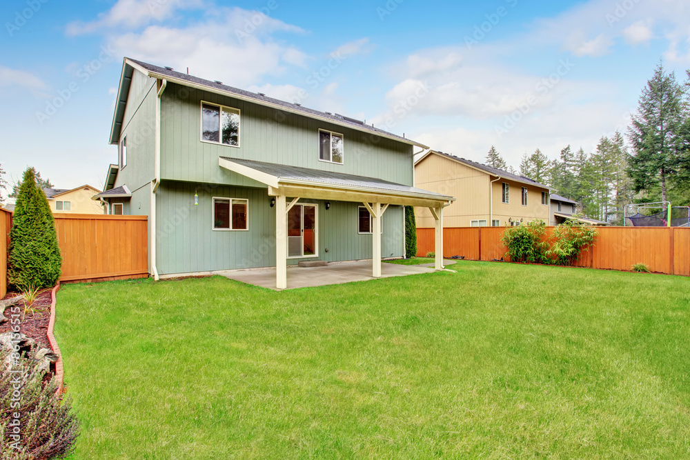 Nice backyard with covered patio. Nice backyard with covered patio.