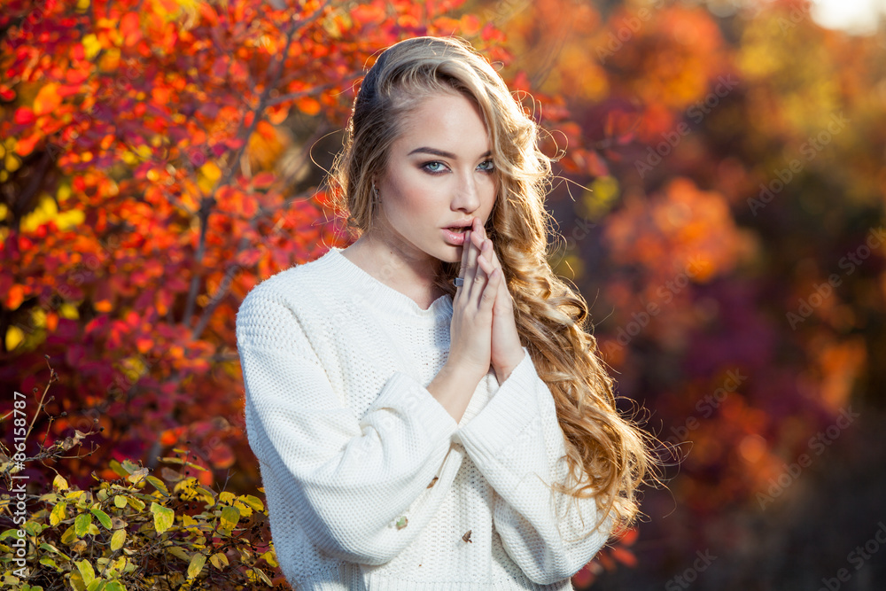 beautiful young woman with curly hair against a background of beautiful young woman with curly hair against a background of