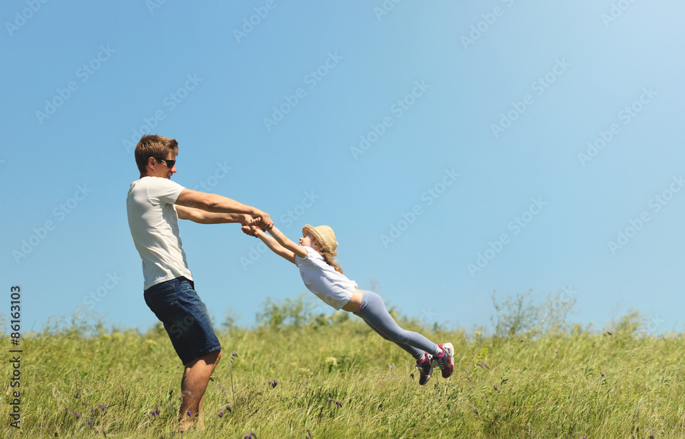 Father and daughter spinnig outdoor Father and daughter spinnig outdoor